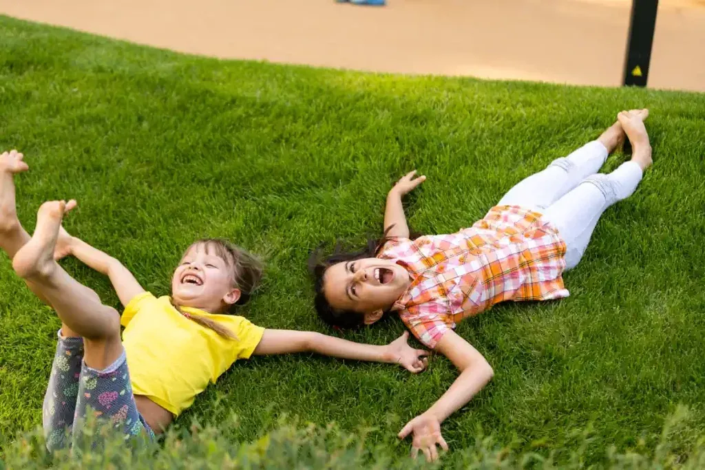 Kids enjoy playing on perfect lawns provided by CIP Landscaping | New Albany Ohio