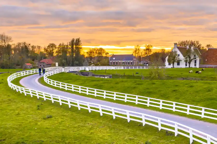 White Fences & Perfectly manicured green grass  by CIP Landscaping | New Albany Ohio